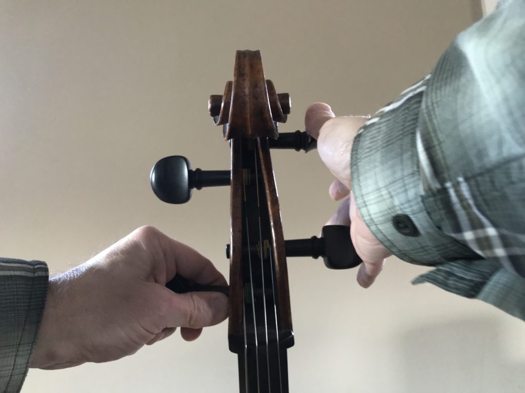 Tune your cello: brace the pegs opposite the one you’re turning